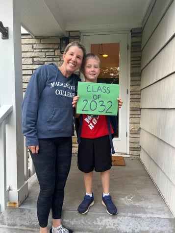 Executive Director of Pinky Swear Foundation Erica Campbell and her son who is holding up a class of 2032 sign.